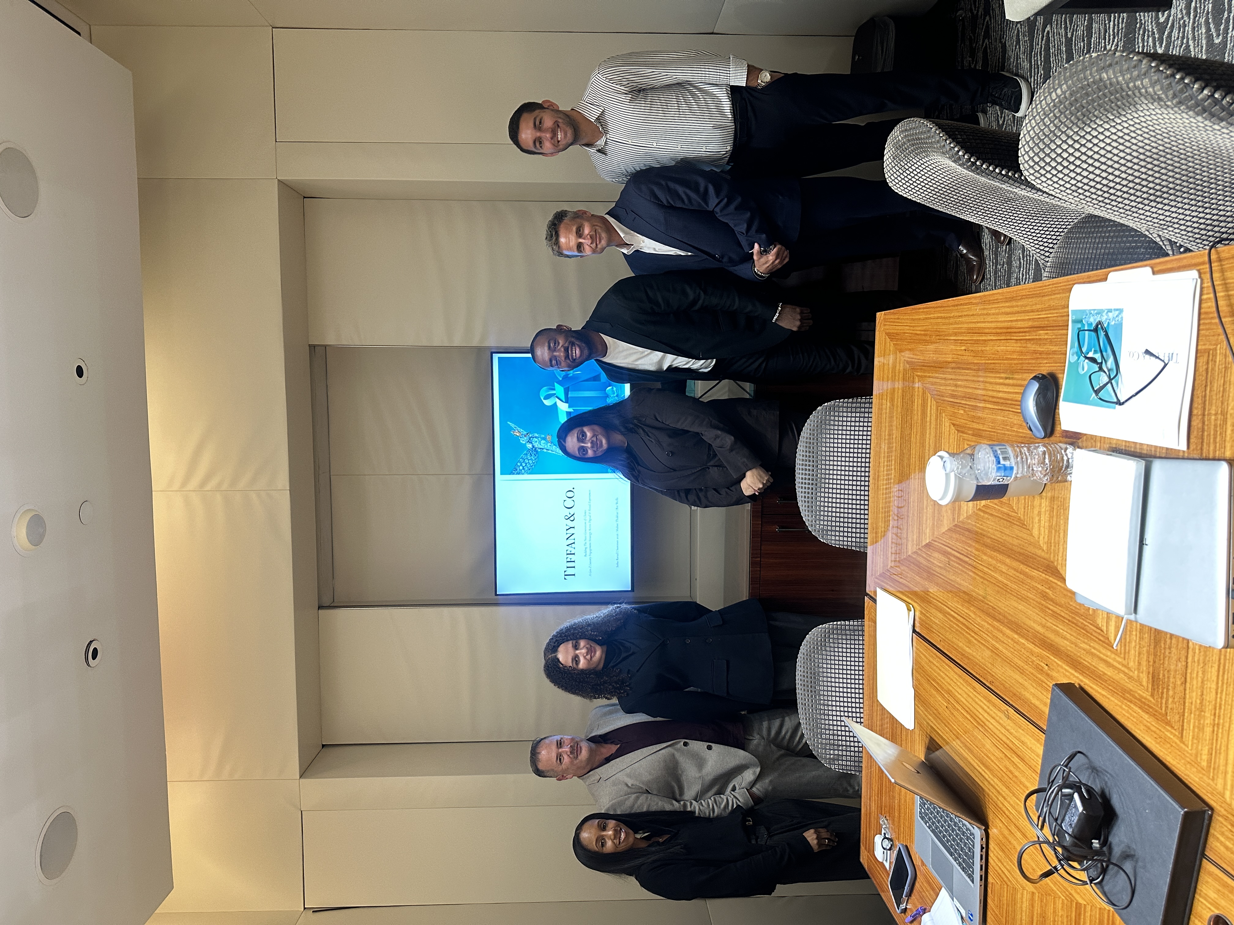 Mahee Thakkar with Tiffany & Co. team members in a meeting room